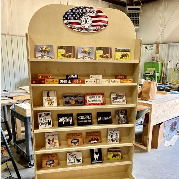 Wooden display shelf with various items in a workshop setting